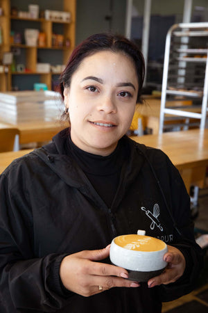 Maria finishing a gorgeous latte at our coffee shop between Burlingame and San Matteo